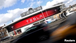 FILE - A Tesla car showroom is seen in west London, Britain, March 21, 2017. 