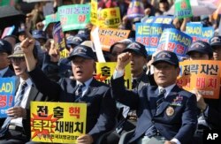 Members of the Korean Veterans Association shout slogans during a rally denouncing North Korea's nuclear and missile provocation in Seoul, South Korea, Sept. 12, 2017.