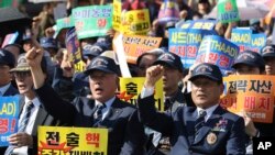 Members of the Korean Veterans Association shout slogans during a rally denouncing North Korea's nuclear and missile provocation in Seoul, South Korea, Sept. 12, 2017.