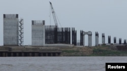 FILE - A view of a construction site by Odebrecht of the third bridge over the Orinoco River is seen in Caicara del Orinoco, Venezuela, March 21, 2017.