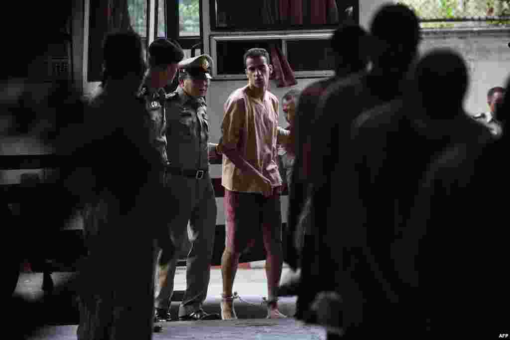 Bahraini footballer Hakeem al-Araibi (C), a refugee and Australian resident, is escorted to a courtroom in Bangkok, Thailand. Al-Araibi, detained by Thai immigration authorities in late Nov. 2018 after arriving in Bangkok for a vacation with his wife, fears torture and even death if he is returned to his homeland.