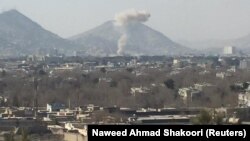 Smoke rises after a car bomb explosion in Kabul, Afghanistan, Jan. 27, 2018, in this image obtained from social media.