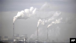 Smokes billows from chimneys of the cooling towers of a coal-fired power plant in Dadong, Shanxi province, China (file photo)