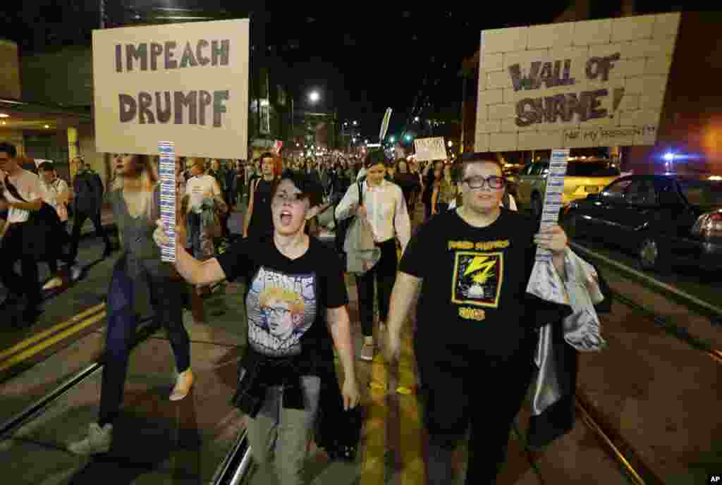 Protesters call for the impeachment of President-elect Donald Trump as they march in Seattle, Nov. 9, 2016.