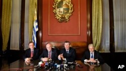 FILE - Brazil's Ambassador to Uruguay Paulo Estivallet, left, Paraguay's Foreign Affairs Minister Eladio Loizaga, second from left, Uruguay's Foreign Affairs Minister Rodolfo Nin, third from left, and Argentina's Vice Foreign Affairs Minister Carlos Foradori give a press conference after a Mercosur meeting on the transition of the organization's presidency in Montevideo, July 11, 2016.