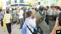 About 100 demonstrators gathered outside the court on Thursday, as the women were remanded to Prey Sar prison. 