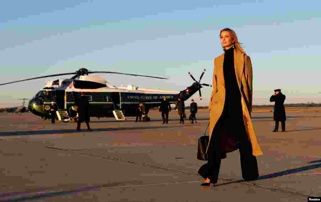 Ivanka Trump walks from Air Force One to a waiting vehicle upon arrival, as U.S. President Donald Trump boards Marine One in the background, at Joint Base Andrews in Maryland, U.S.