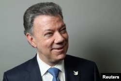 FILE - Colombian President Juan Manuel Santos poses for a portrait as he exits a Reuters Newsmaker conversation in Manhattan, New York, Sept. 21, 2016.