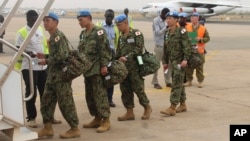 Japan's Ground Self-Defense Force troops board a plane as they start leaving South Sudan, April 17 2017, as part of the process to end their five-year participation in the ongoing U.N. peacekeeping mission.