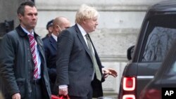 Britain's Prime Minister Boris Johnson leaves Downing Street in London, Dec. 17, 2021.