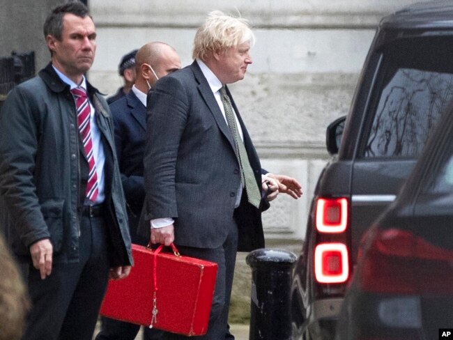 Britain's Prime Minister Boris Johnson leaves Downing Street in London, Dec. 17, 2021.