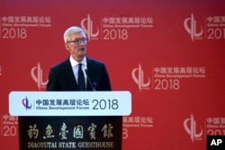 Tim Cook, Apple CEO delivers his speech at the opening ceremony of the China Development Forum held at the Diaoyutai State Guesthouse in Beijing, March 25, 2018.