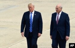 FILE - President Donald Trump and White House Chief of Staff John Kelly walk toward Air Force One at Andrews Air Force Base in Maryland, May 4, 2018.