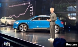 Audi of America President Scott Keogh introduces the German luxury brand's first all-electric production vehicle, the e-tron sport utility vehicle, at an event in Richmond, Calif., Sept. 17, 2018.