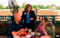 Republican Karen Handel campaigns at a restaurant in Johns Creek, Ga., June 16, 2017, ahead of a runoff election to replace former Representative Tom Price.