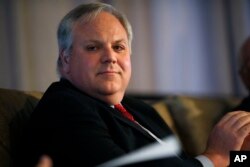 FILE - U.S. Deputy Secretary of the Interior David Bernhardt waits to speak during the annual state of Colorado energy luncheon sponsored by the Colorado Petroleum council, July 26, 2018, in Denver.