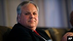 FILE - U.S. Deputy Secretary of the Interior David Bernhardt waits to speak during the annual state of Colorado energy luncheon sponsored by the Colorado Petroleum council, July 26, 2018, in Denver. 