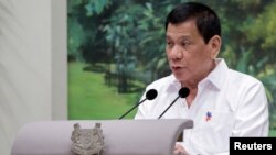 Philippines President Rodrigo Duterte delivers a speech at the start of a state dinner hosted by Singapore's President Tony Tan at the Istana in Singapore, Dec. 15, 2016.