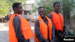 Suspected pirates involved in the attempted hijacking in April of the OS35, a Tuvalu-flagged cargo ship, are seen after Chinese navy officers handed them over to the Somali authorities in the city of Bosaso.