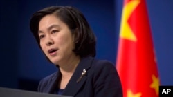 FILE - Chinese Foreign Ministry spokeswoman Hua Chunying speaks during a briefing at the Chinese Foreign Ministry in Beijing.
