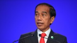 Indonesia's President Joko Widodo presents his national statement as part of the World Leaders' Summit of the COP26 UN Climate Change Conference in Glasgow, Scotland on Nov. 1, 2021.