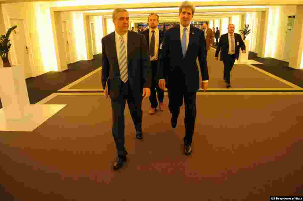 U.S. Secretary of State John Kerry and U.S. Ambassador to NATO Douglas Lute walk to the first in a series of meetings at NATO Headquarters in Brussels, Belgium, on Dec. 4, 2013.