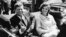Former United States President John F. Kennedy and first lady Jackie Kennedy sit in a car in front of Blair House during the arrival ceremonies for Habib Bourguiba, president of Tunisia, in Washington, in this handout image taken on May 3, 1961.