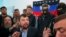 Denis Pushilin, foreground center, spokesman of the self-appointed Donetsk People’s Republic, speaks to reporters inside the regional administration building seized earlier in Donetsk, Ukraine, April 18, 2014. 