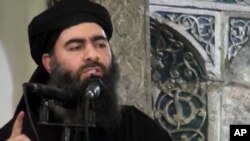 FILE - Image taken a from video shows a man purported to be Abu Bakr al-Baghdadi, senior leader of the Islamic State militant group. 