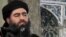 This file image made from video posted on a militant website in July 2014, which has been authenticated based on its contents and other AP reporting, purports to show Abu Bakr al-Baghdadi, the leader of the Islamic State group, delivering a sermon at a mosque in Mosul, Iraq. 