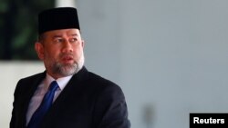 Malaysian former King Muhammad V attends a welcome ceremony at the Parliament House in Kuala Lumpur, Malaysia in 2017. Muhammad V stepped down after two years in power. Malaysia is a constitutional monarchy in which the king's duties are largely ceremonial.