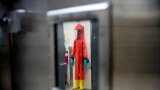 FILE - In this March 19, 2020, file photo, a biosafety protective suit for handling viral diseases are hung up in a biosafety level 4 training facility at U.S. Army Medical Research and Development Command at Fort Detrick in Frederick, Md. (AP Photo/Andr