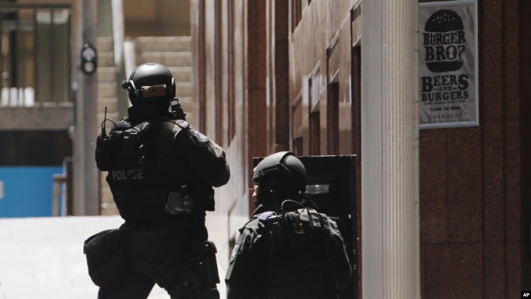FILE - Police anti-terror forces are seen dispatched in Martin Place in the central business district of Sydney, Australia, Dec. 15, 2014.