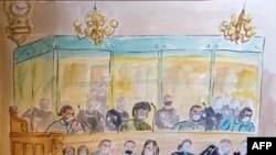 A courtroom sketch shows, from left to right, Ayoub El Khazzani, Mohamed Bakkali, Bilal Chatra and Redouane El Amrani Ezzerrifi sitting in the dock of the Paris Courthouse in Paris on Nov. 16, 2020. 