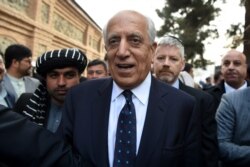 FILE - U.S. Special Representative for Afghanistan Reconciliation Zalmay Khalilzad leaves the Presidential Palace in Kabul, March 9, 2020.