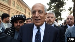 FILE - U.S. Special Representative for Afghanistan Reconciliation Zalmay Khalilzad leaves the Presidential Palace in Kabul, March 9, 2020.