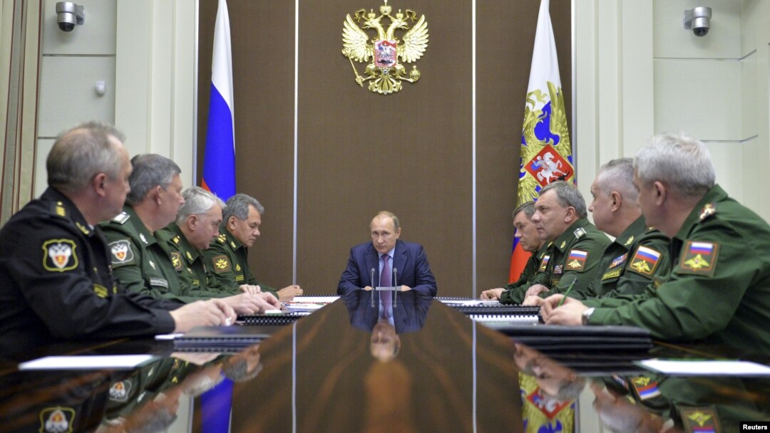 Russian President Vladimir Putin, center, chairs a meeting on the defense industry at the Bocharov Ruchei state residence in Sochi, Russia, Nov. 10, 2015. 