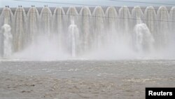 FILE - Picture of the overflowing Sardar Sarovar Narmada dam in Kavadia, 194 km (121 miles) south of the western Indian city of Ahmedabad, Aug. 10, 2012.