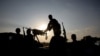 FILE - Somali National Army soldiers stand guard against al-Shabab militants in the Middle Shabelle region in Somalia, Dec. 10, 2012. Somali officials say more than 100 militants were killed Feb. 20, 2025, during al-Shabab attacks on military bases in the region. 