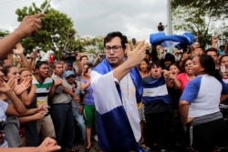 Opposition leader Yubrank Suazo, who according to local media was arrested for participating in a protest against Nicaraguan President Daniel Ortega's government, dances after being released from La Modelo Prison, in Masaya, June 11, 2019.