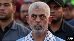 (FILES) Head of the political wing of the Palestinian Hamas movement in the Gaza Strip Yahya Sinwar attends a rally in support of Jerusalem's al-Aqsa mosque in Gaza City on October 1, 2022.