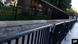 Two layers of fence are seen along the North Lawn of the White House in Washington, D.C.,Sept. 23, 2014.