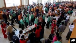 Myanmar lawmakers gather after a regular session of the lower house of parliament, Feb 1, 2016, in Naypyitaw, Myanmar. 