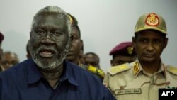 FILE - Sudan People Liberation Movement-North (SPLM-North) leader Malik Agar (L) speaks as Sudanese Deputy head of the Transitional Military Council, General Mohamed Hamdan Daglo (R), looks on during a press conference in Juba, South Sudan, July 27, 2019.