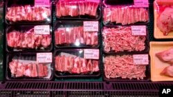 Packs of Canadian pork are displayed for sale at a supermarket in Beijing, June 18, 2019. 