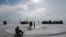 People enjoy good weather on the Lake Baikal covered with ice near the Siberian village of Listvyanka, in Irkutsk region, Russia, March 13, 2019. 