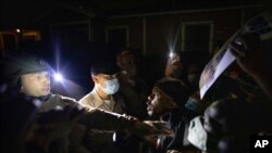 Protesters clash with deputies of the Los Angeles Sheriff's Department during protests following the death of Dijon Kizzee, Aug. 31, 2020, in Los Angeles, California. 