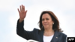 (FILES) US Vice President Kamala Harris makes her way to board a plane before departing from Andrews Air Force Base in Maryland on June 14, 2021. Harris is traveling to Greenville, South Carolina to kick off a national vaccination tour.