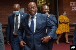 FILE - Former South African President Jacob Zuma enters the High Court in Pietermaritzburg, South Africa on January 31, 2022. He has denounced the ANC and says he will vote for a newly-formed political formation in the country’s general elections.