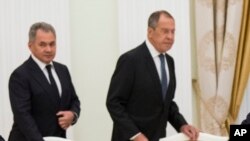 FILE - Russia's Defense Minister Sergei Shoigu (L), and Foreign Minister Sergey Lavrov are seen during a meeting between Russian President Vladimir Putin and U.S. National security adviser John Bolton in the Kremlin in Moscow, June 27, 2018. 